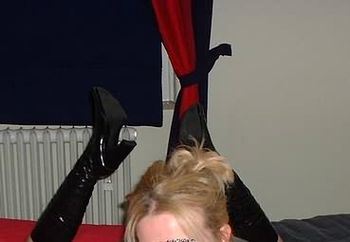 my thigh-high black pvc boots