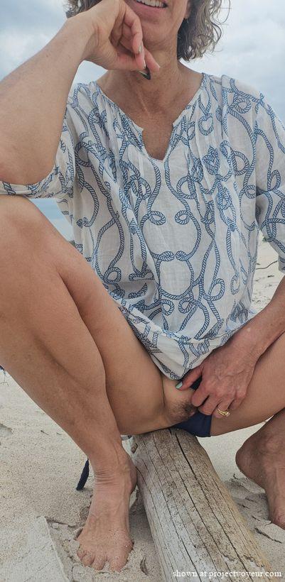 Cyndi get undressed at beach - image6