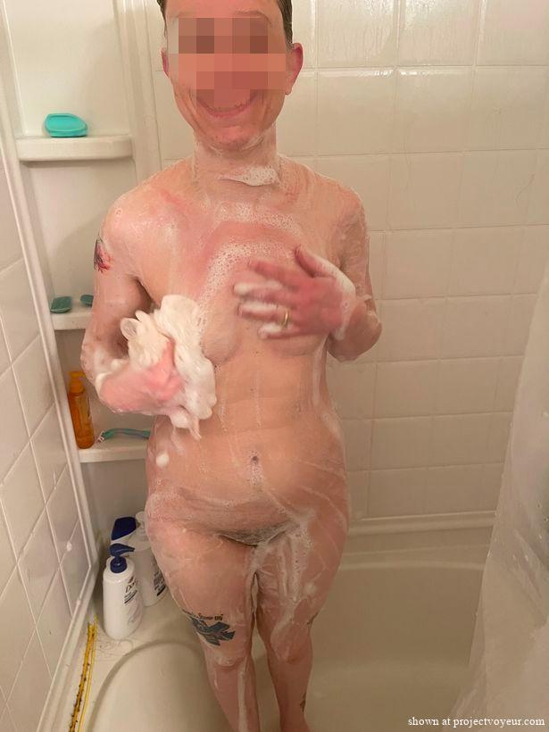 Pretty wife showering - image1