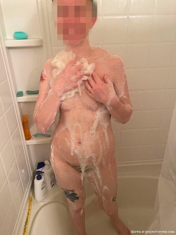 Pretty wife showering - image7