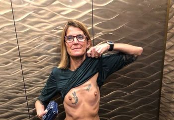showing off her tiny tits
