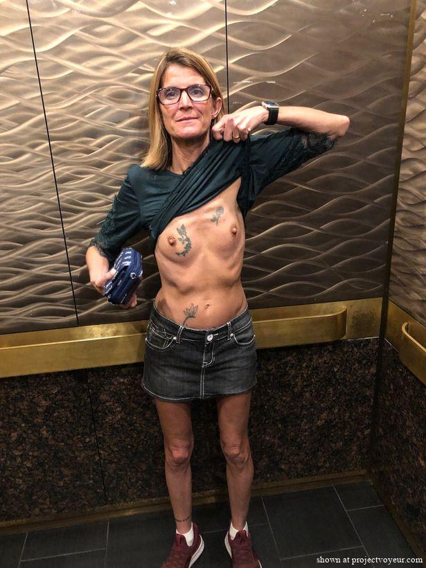showing off her tiny tits - image1