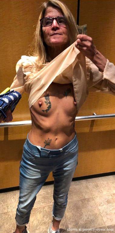 showing off her tiny tits - image2