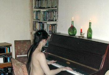 Sexy girl playing piano