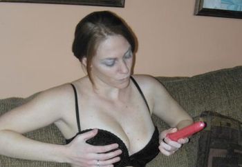 Redhead coed Mariah plays with her toy