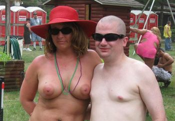 Red Hat Lady posing with a guy