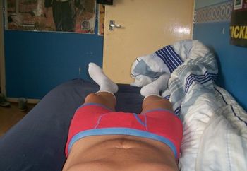 Lying in bed horny