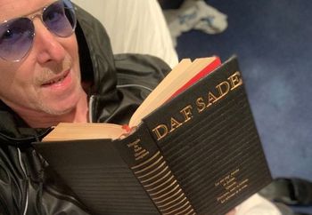 Masturbating while reading smut by Sade