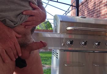Outside grilling some burgers 